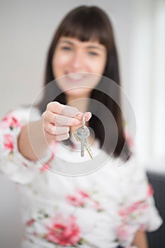 Woman Moving Into New Home Holding Bunch Of Keys