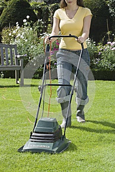 Woman Mowing Lawn