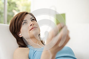 Woman with mp4 at Home photo