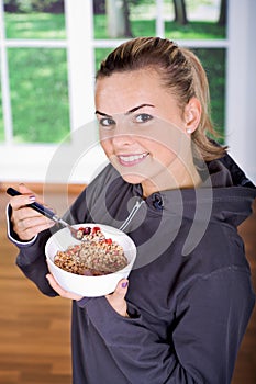Woman with muesli bowl