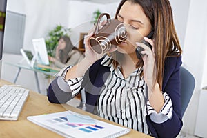 Woman multi-tasking in office