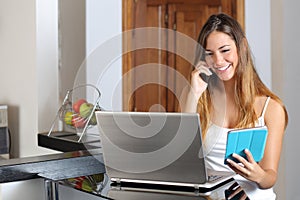 Woman multi tasking working with a laptop tablet and phone