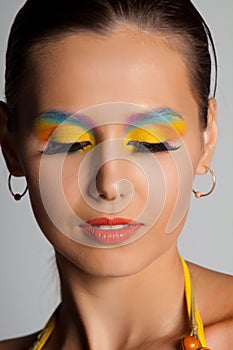 Woman and multicolored make-up.