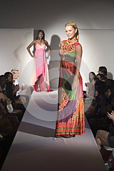 Woman In Multicoloured Dress On Fashion Catwalk