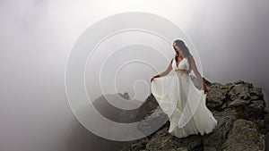 Woman on mystical mountain top