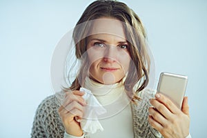 Woman with napkin ordering pills in pharma online shop