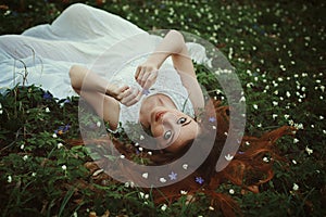 Woman on natural bed of flowers