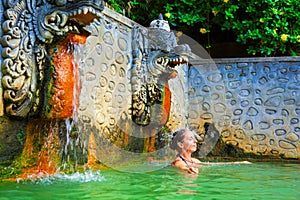 Woman in natural hot spring Air Panas Banjar on Bali