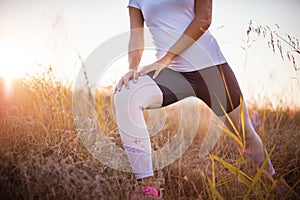 Woman in nature working exercise and stretching