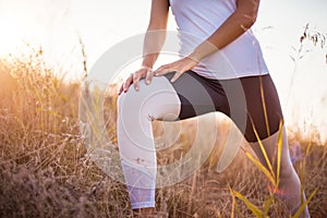 Woman in nature working exercise and stretching