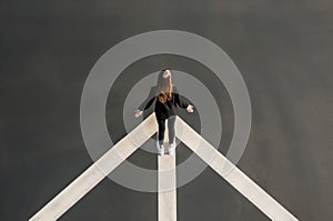 Woman near arrow asphalt top view. Generate ai