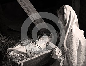 Woman near the baby in the manger