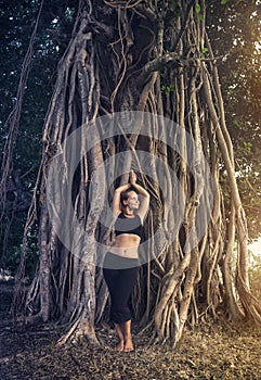 Woman near banyan tree