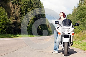 Woman near a motorcycle