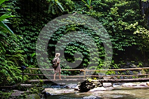 Woman near Nung Nung waterfal on Bali, Indonesia