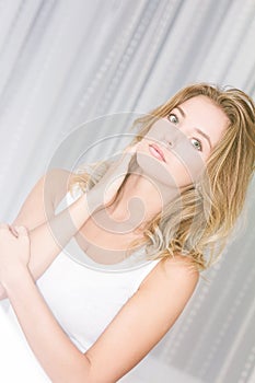 Woman near window at home