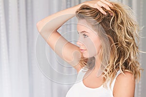 Woman near window in the morning, peaceful lifestyle, he