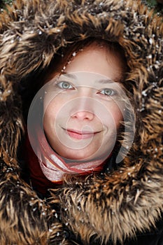 Woman in with neck piece and red scarf