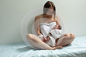 Woman with new born baby have a rest