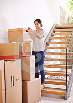 Woman, new home and moving boxes for property investment, rental apartment or real estate loan. Smile, tenant and female