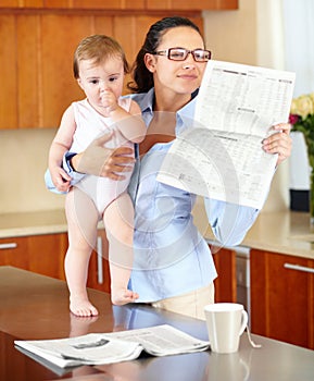 Woman, newspaper and baby while reading in kitchen with headline or article. Single mother, glasses and little girl