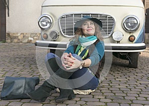 Woman next to retro minivan