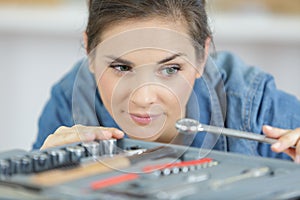 woman next to tool box