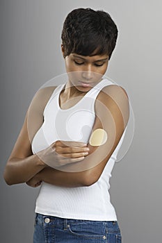 Woman With Nicotine Patch On Arm