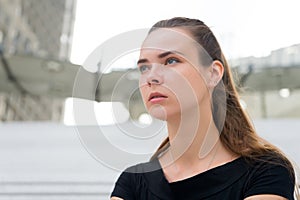 Woman with no makeup face in paris, france. Woman with long hair on blurred cityscape. Girl with young look and sensual beauty. Fa