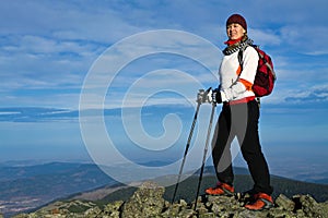 Woman on Nordic Walking in mountains