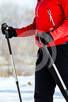 Woman nordic walking in winter, healthy lifestyle