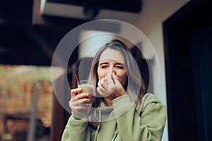 Woman Not Standing the Smell of the Caffeine Beverage photo