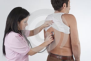 Woman Nurse Auscultation a Man photo