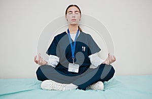 Woman, nurse and meditate to relax in hospital, healing and break from work, yoga and calm for mental health. Medical