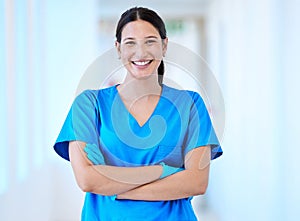 Woman, nurse and portrait with arms crossed and smile in a hospital and clinic. Employee, healthcare and wellness