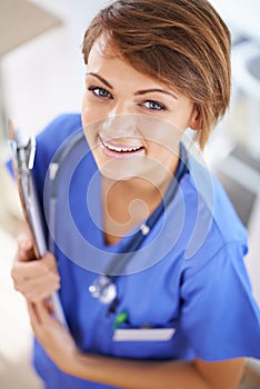Woman, nurse and smile portrait with clipboard in medical office, nutritionist and stethoscope, professional nursing
