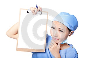 Woman nurse thinking showing clipboard