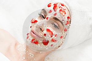 Woman with oatmeal & strawberry mask