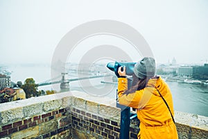 Woman at observation deck enjoy view of the city