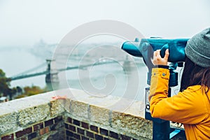 Woman at observation deck enjoy view of the city