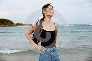 woman ocean travel lifestyle beach vacation summer sand sea sunset smile