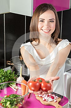 Woman offers tomatoes