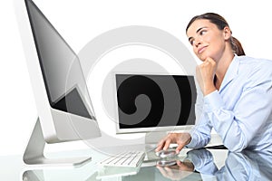 Woman in office at desk front of computer screen, mouse click