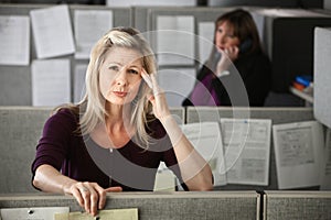 Woman in Office with Headache