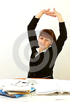 Woman in office stretching