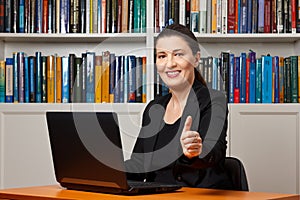 Woman office thumbs up smile photo