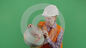 Woman Oil Engineer Examining Globe
