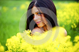 Woman on oilseed field