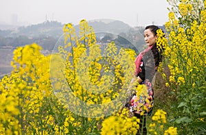 Woman and oilseed flower