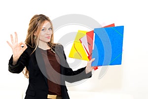 Woman with OK gesture and folder